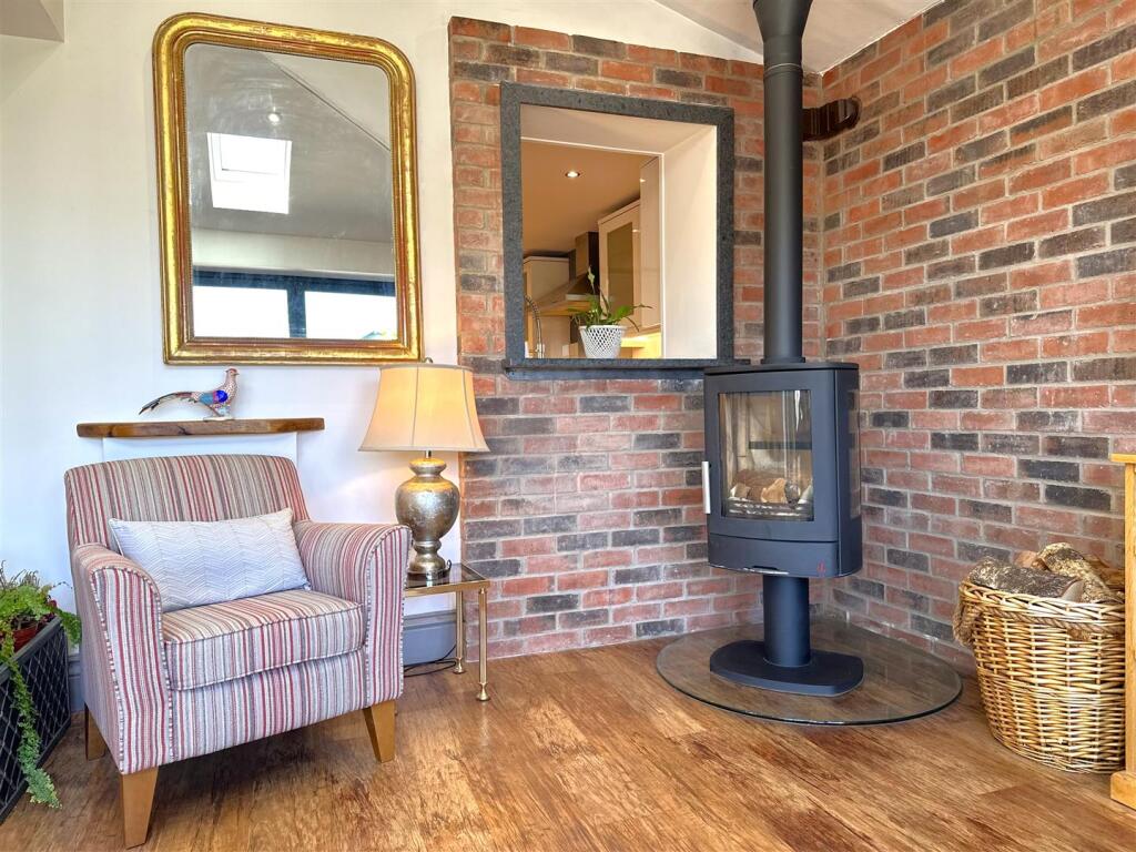 Wood Burning Stove &amp; Exposed Brick Wall 986