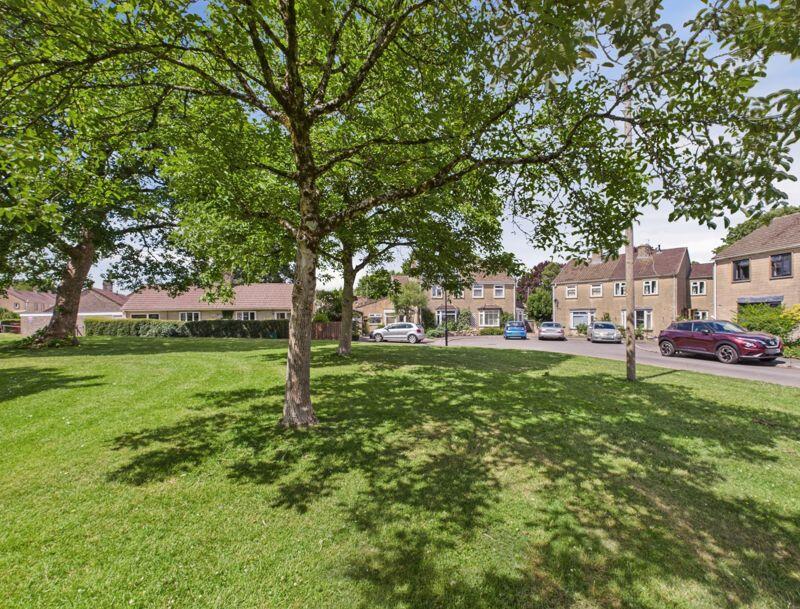 Adjacent green to house