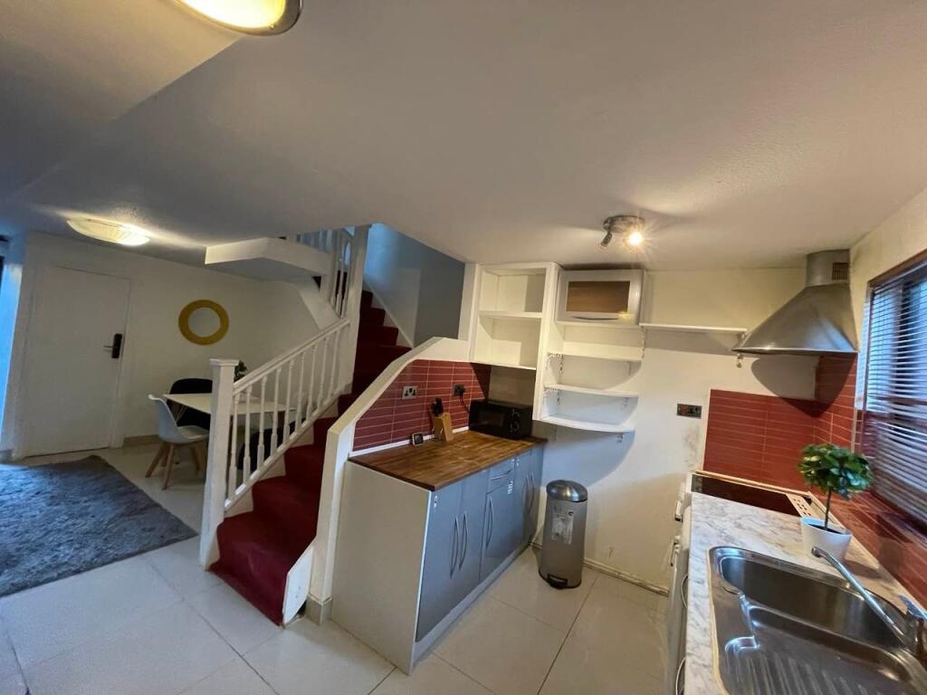 Bright and modern kitchen with ample counter sp...