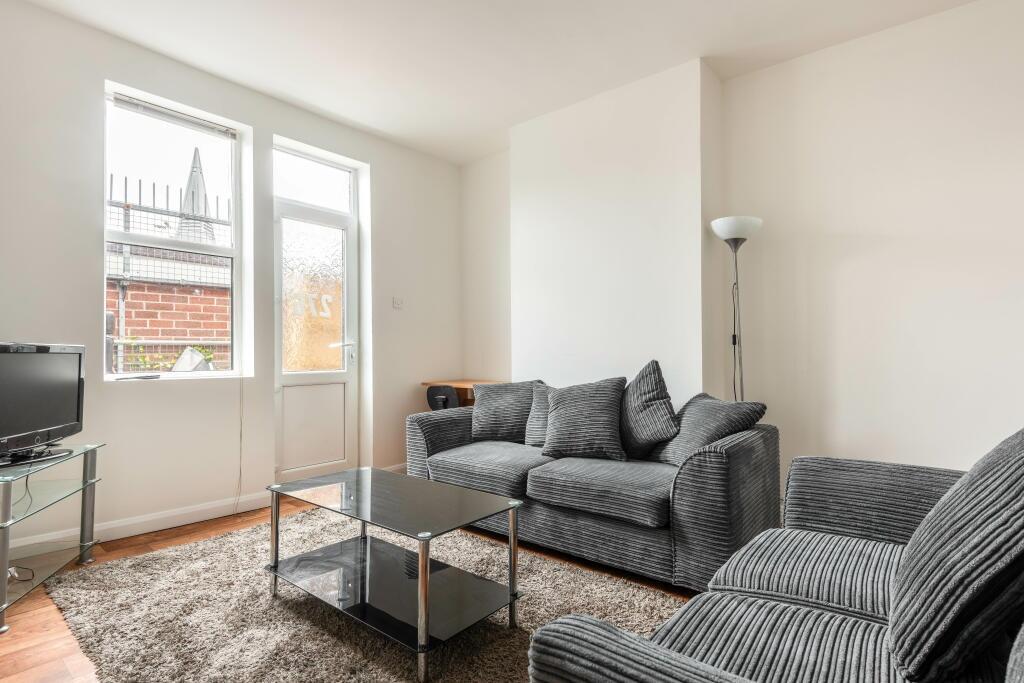 Bright and contemporary living room featuring c...