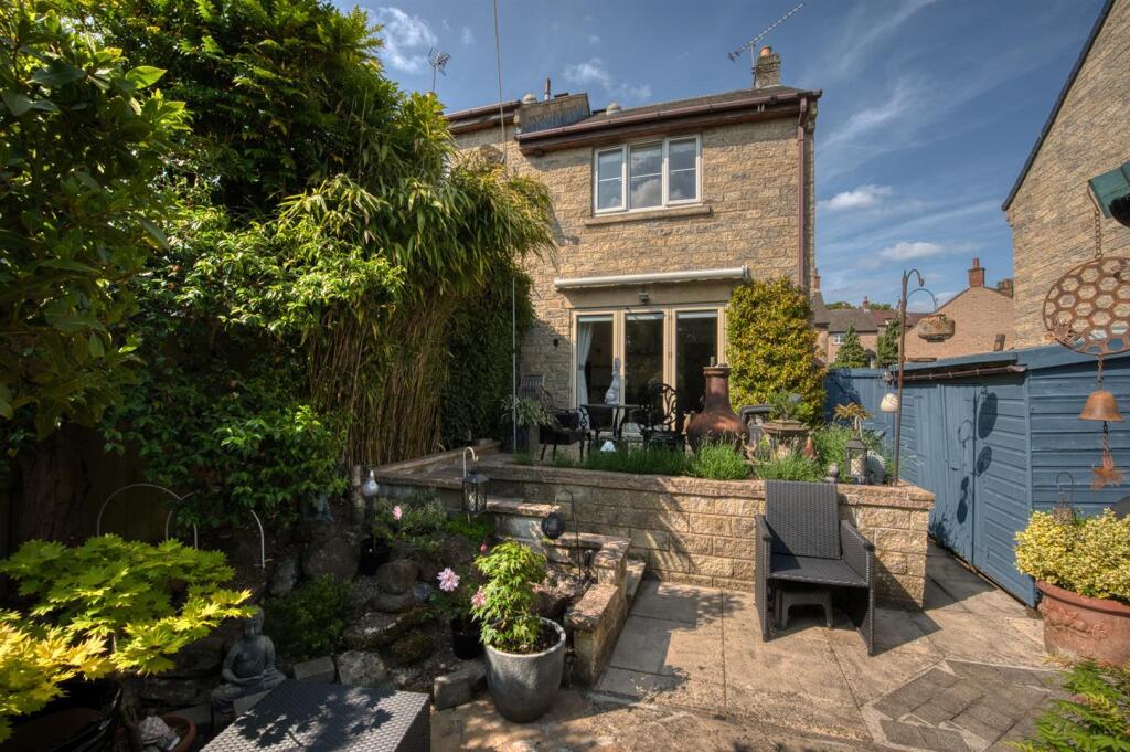 Rear of the home and smaller shed.jpg