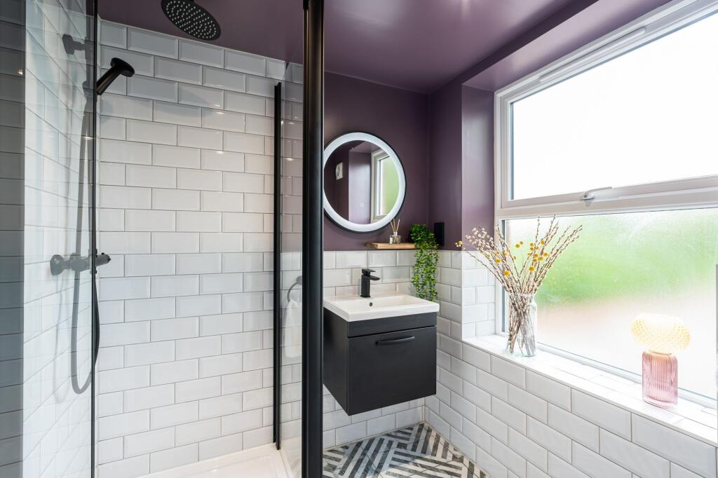 Modern bathroom with stylish white subway tiles...