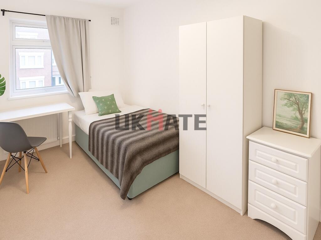 A bright, inviting single bedroom with a comfor...