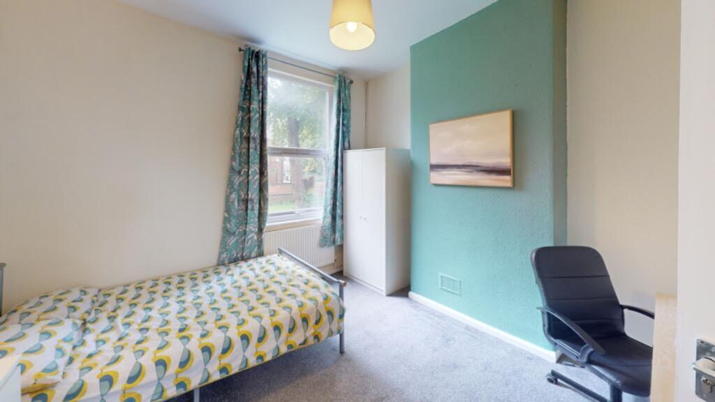 A bright and inviting double bedroom featuring ...