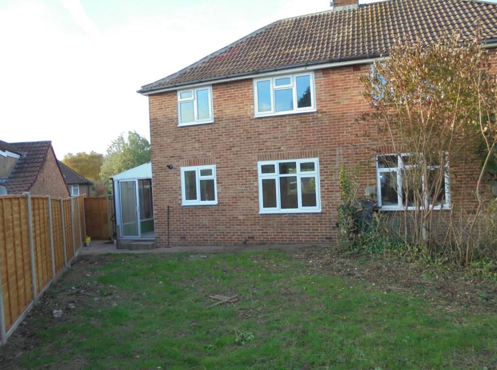 A spacious and inviting backyard with ample nat...
