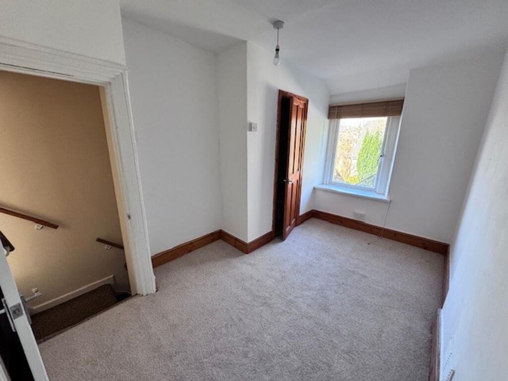 Bedroom 1  with bathroom accessed via wooden door