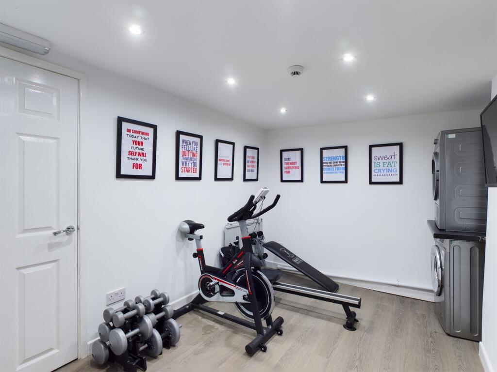 A modern and clean gym space equipped with vari...