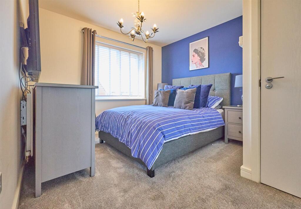 BEDROOM ONE TO REAR