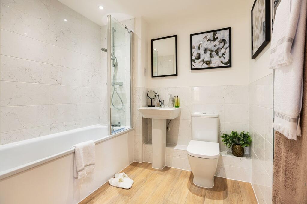 Family bathroom with shower over bath
