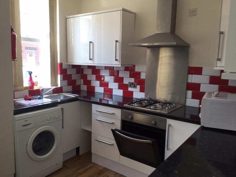 A modern kitchen with ample counter space, a wa...