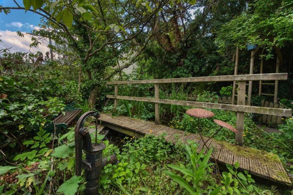 Bridge, pond and seating area.jpg