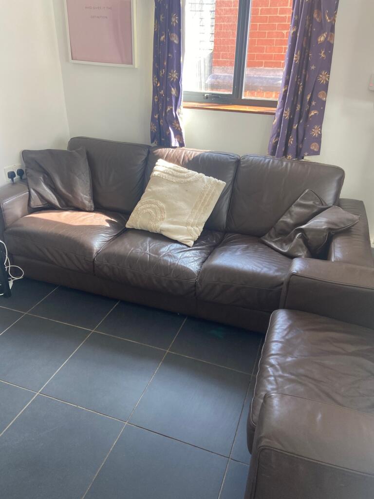 A bright and inviting living room featuring a s...