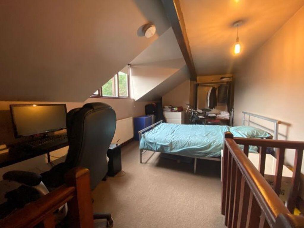 A tidy and functional small room with a simple ...