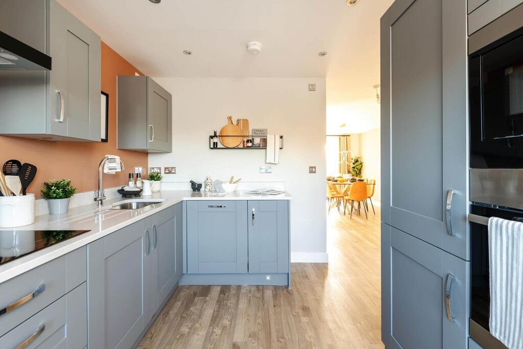 The spacious hallway leads you to the modern kitchen