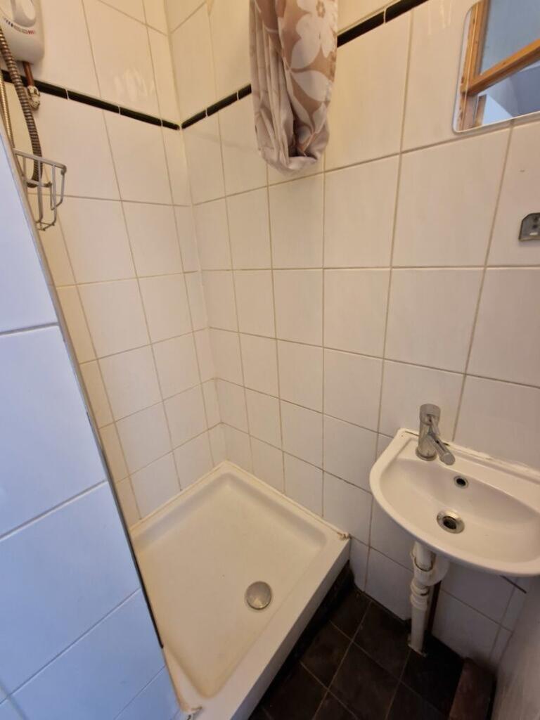 A tidy bathroom featuring modern tiles and esse...
