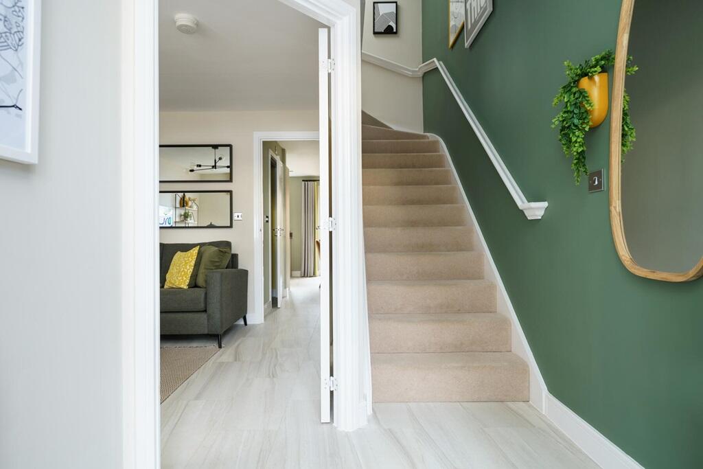 The entrance hall leads into the light and spacious lounge