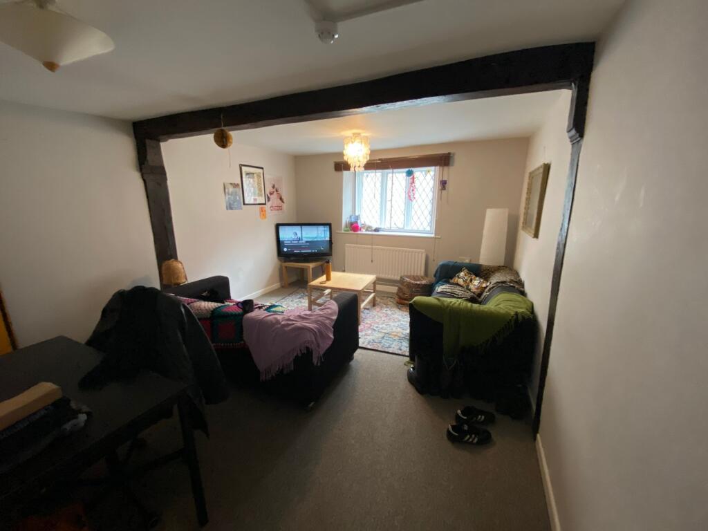 A cozy living room featuring a comfortable seat...