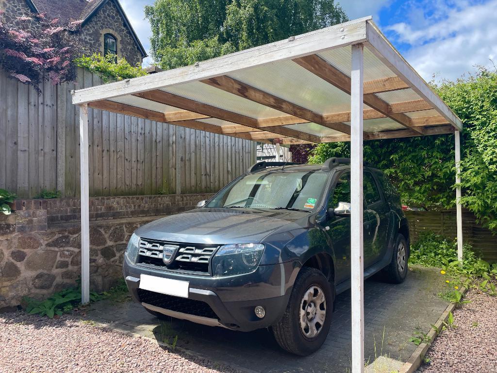 Car port located at end of the drive