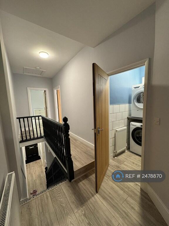 Upstairs Hallway With Laundry