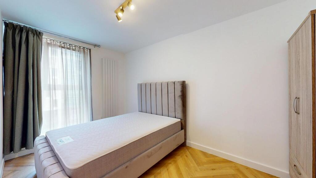 A modern double bedroom featuring a comfortable...