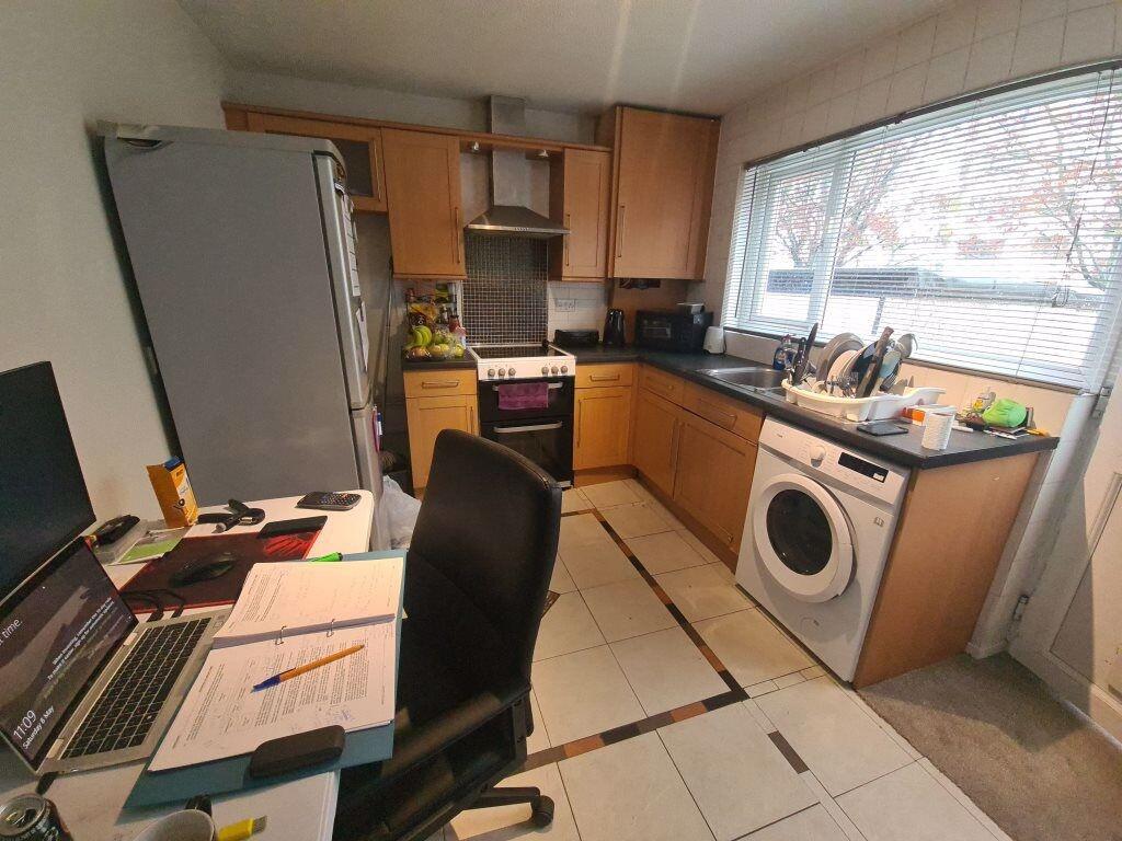 Bright fitted kitchen with plentiful worktops, ...