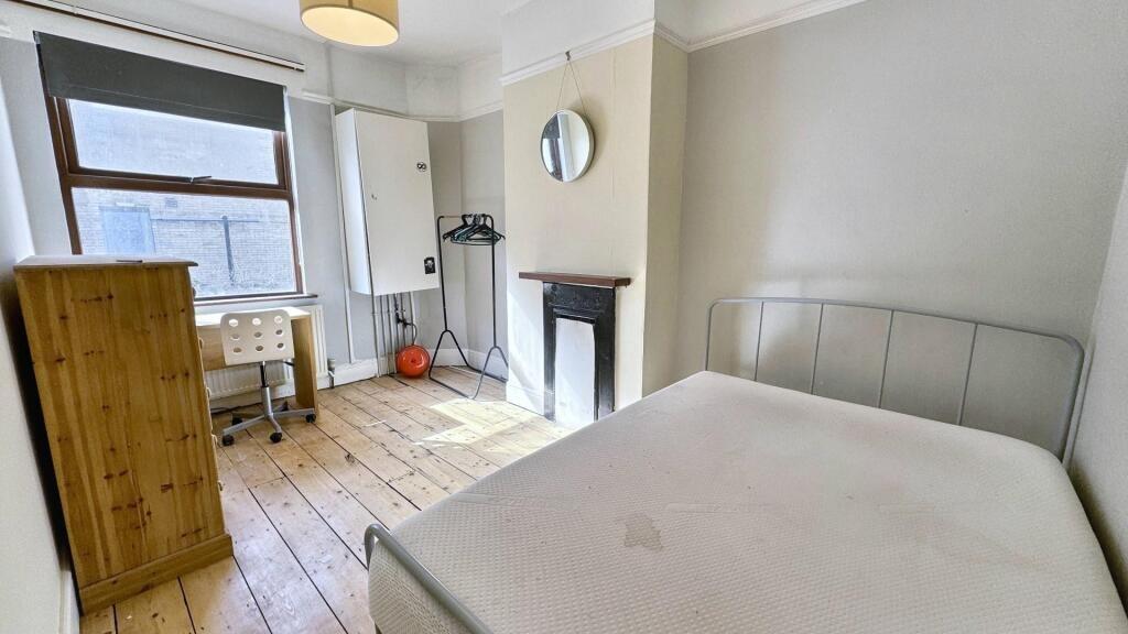 Bright and airy double bedroom featuring a comf...