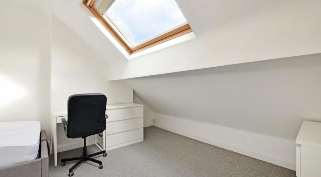 Bright and cozy double bedroom featuring a larg...