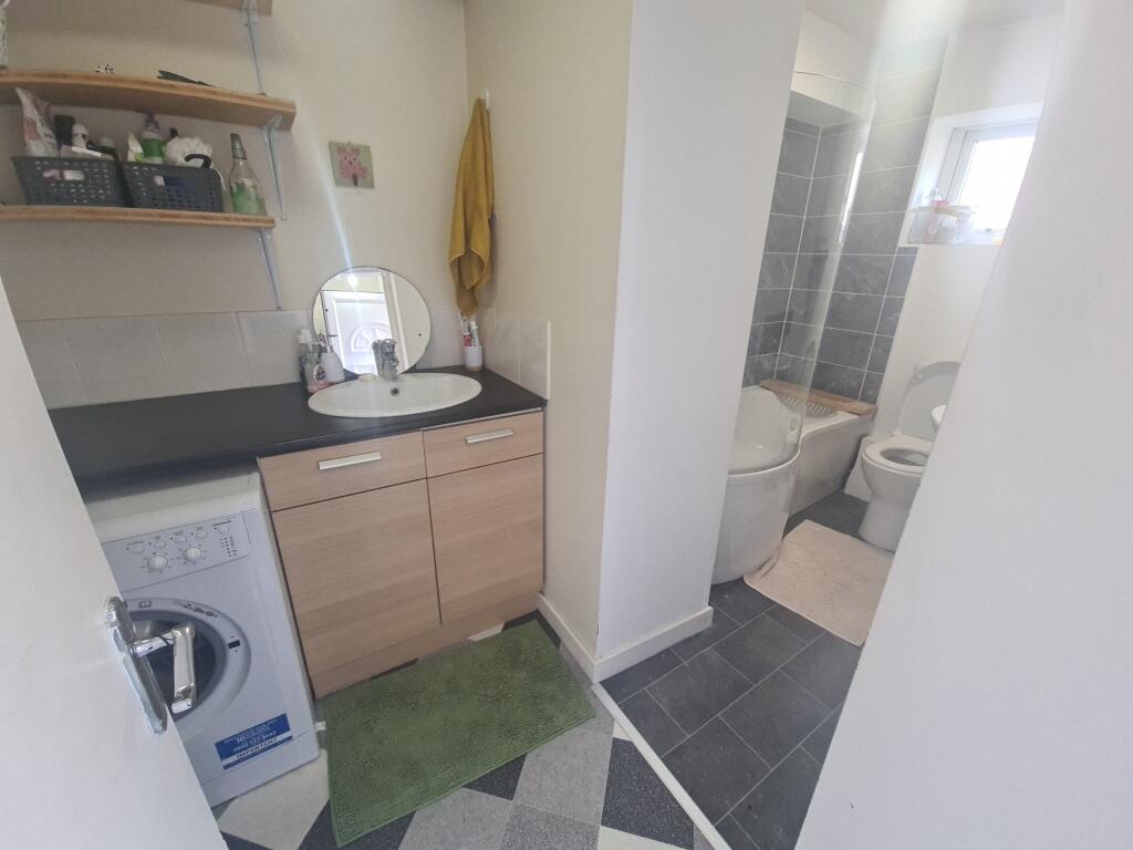 A bright and modern kitchen area featuring a co...