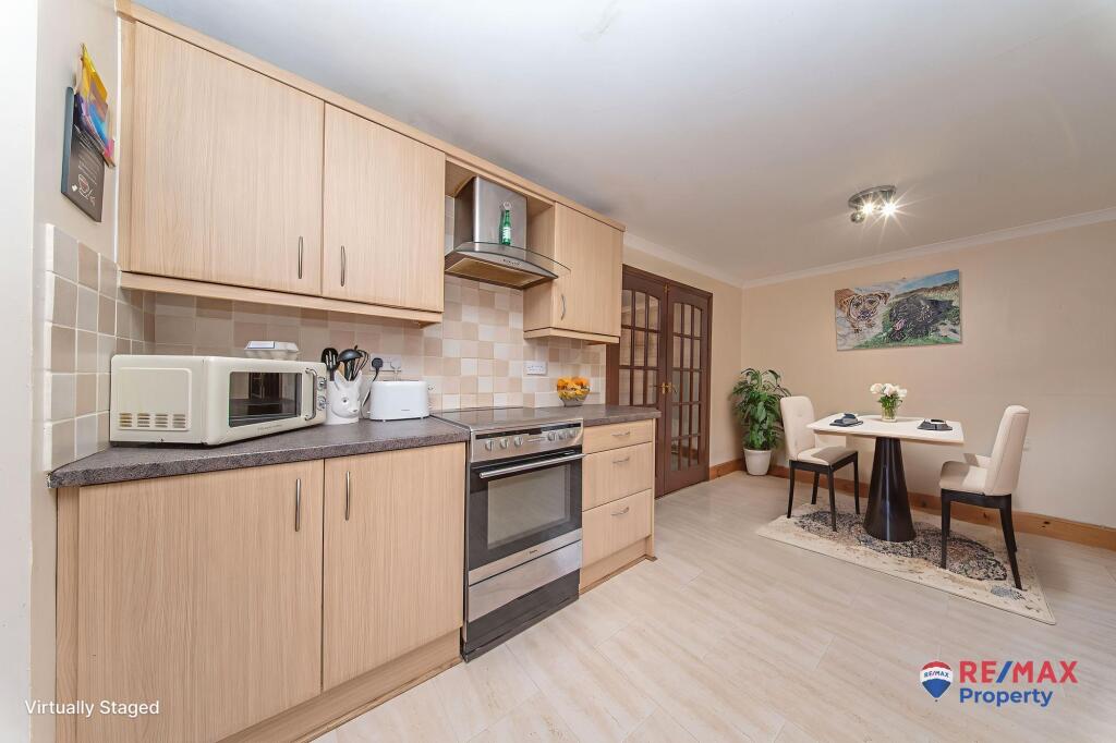 Kitchen With Virtually Staged Dining