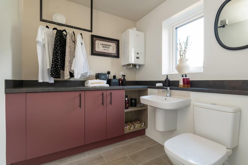 Spacious dual WC/utility at the front of the home