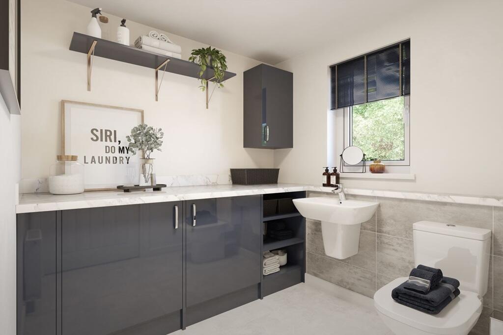 A downstairs toilet and utility room adds convenience