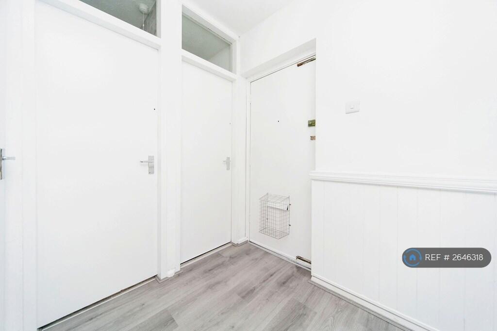 Large Hallway With Four Floor To Ceiling Cupboards