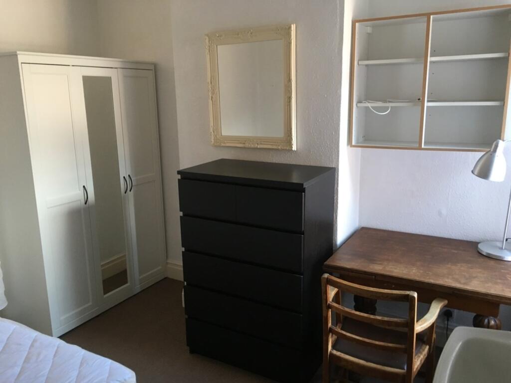 Bright and inviting double bedroom featuring am...