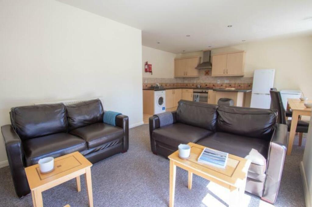 A spacious and inviting large modern living roo...