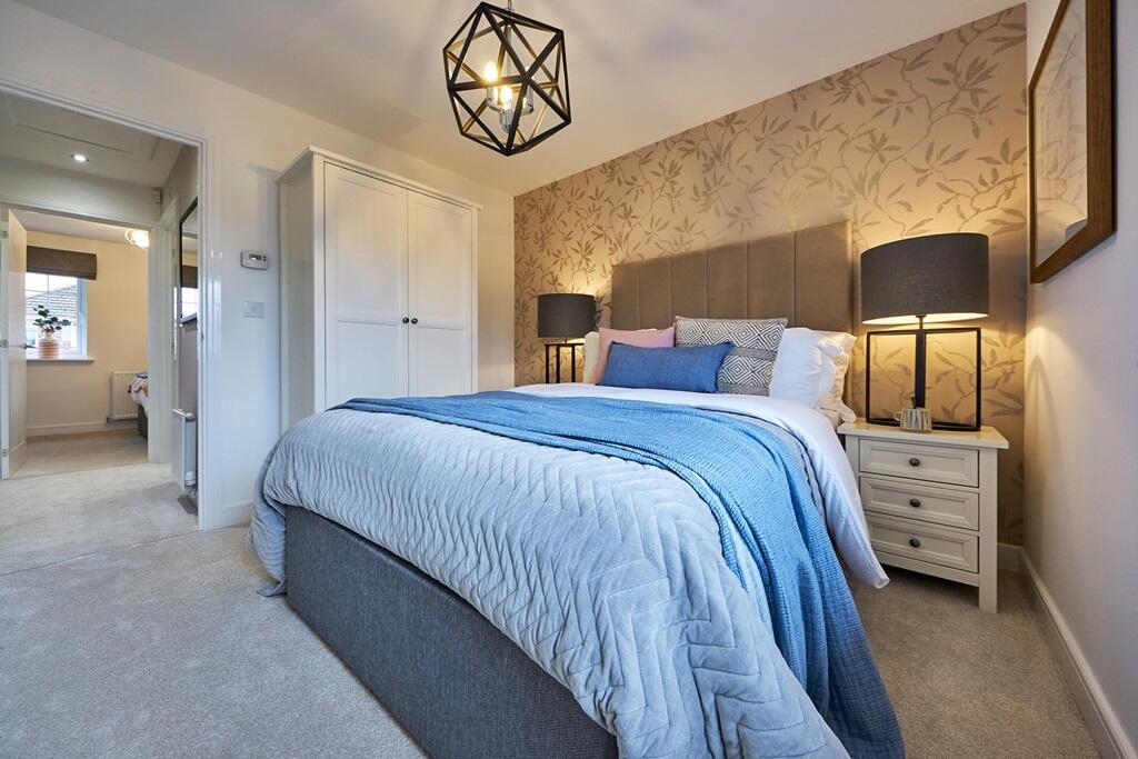 Relax after a long day in the main bedroom