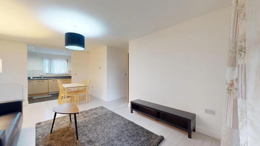 A bright and modern living room featuring a coz...