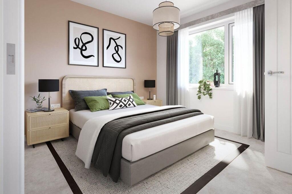 The main bedroom flooded with light from large windows