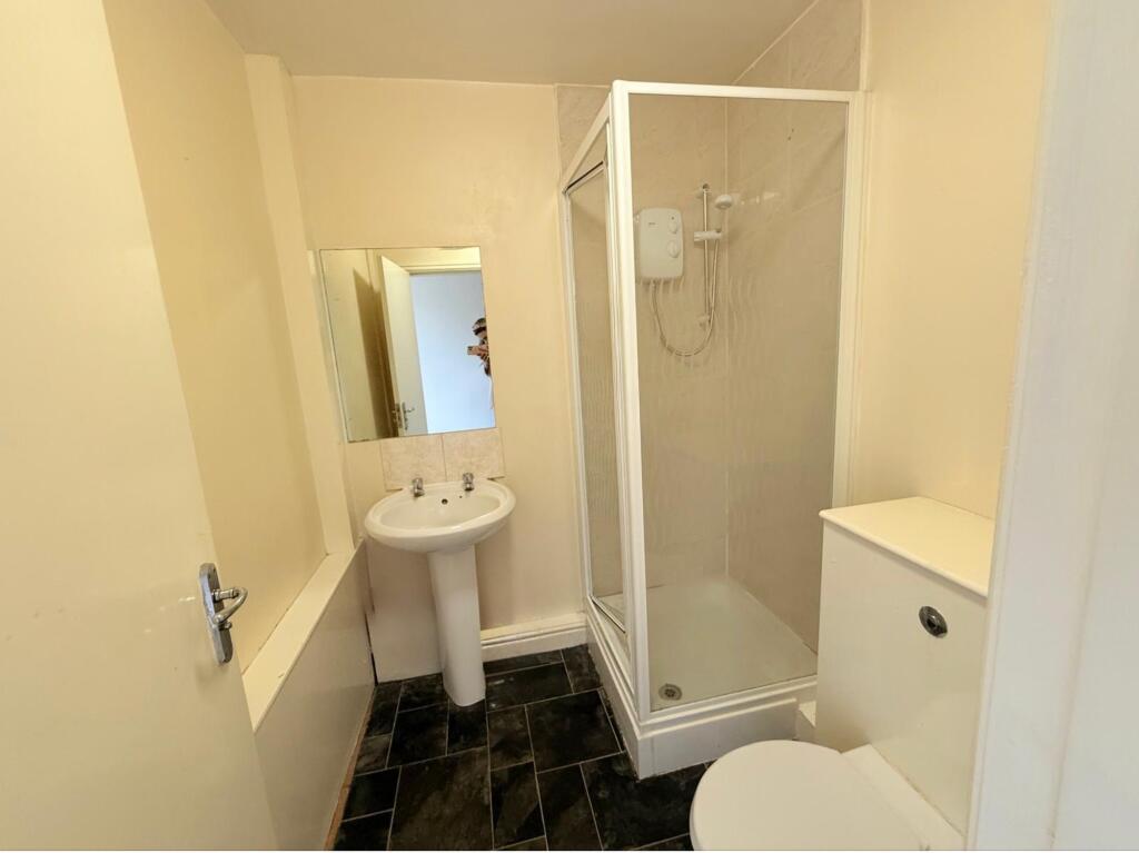 A clean and functional bathroom featuring a cor...