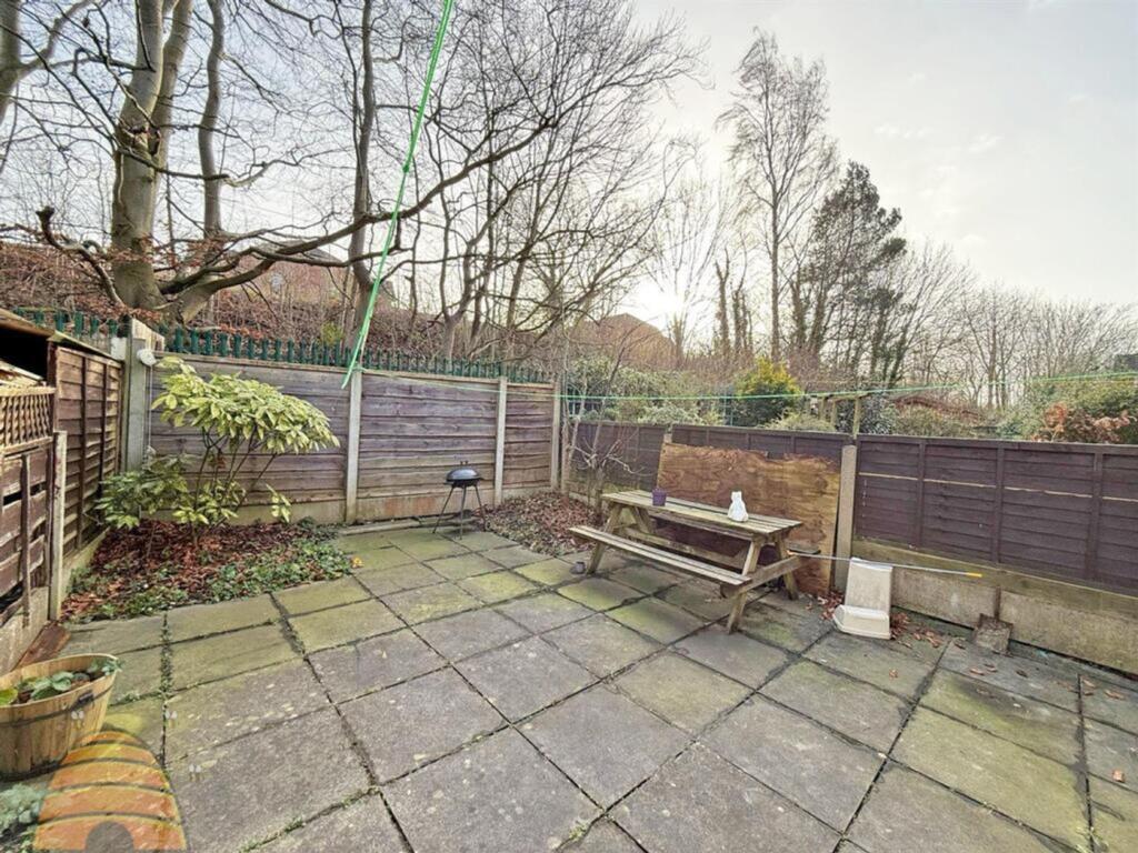 A spacious garden area perfect for relaxation a...