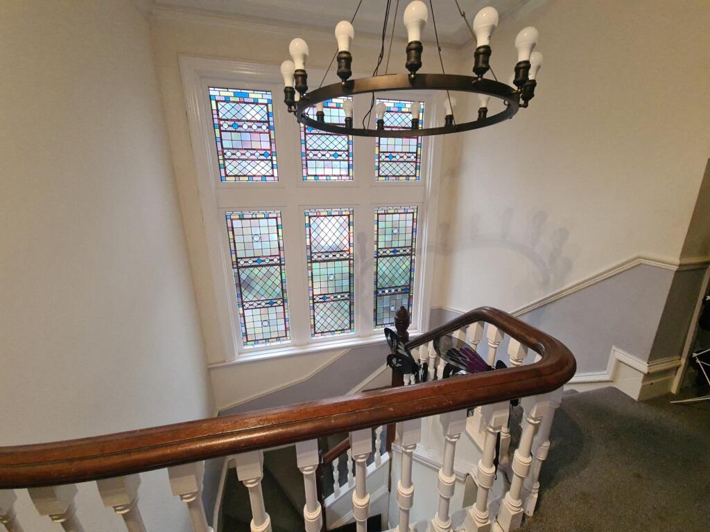 A charming staircase with a classic wooden hand...