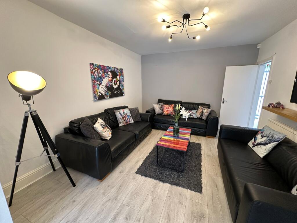 A stylish and inviting living room featuring co...