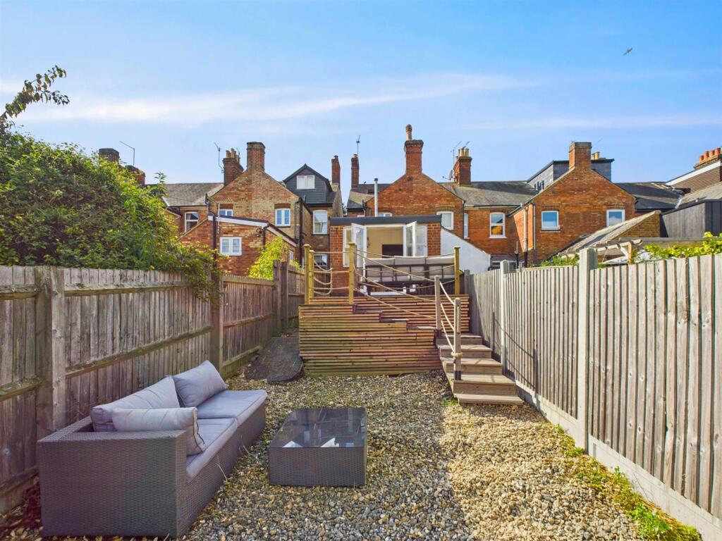 9 The Leys Looking at deck from garden.jpg