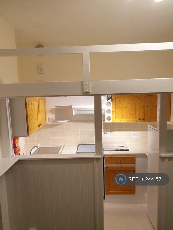 Kitchen With Mezzanine Platform Above