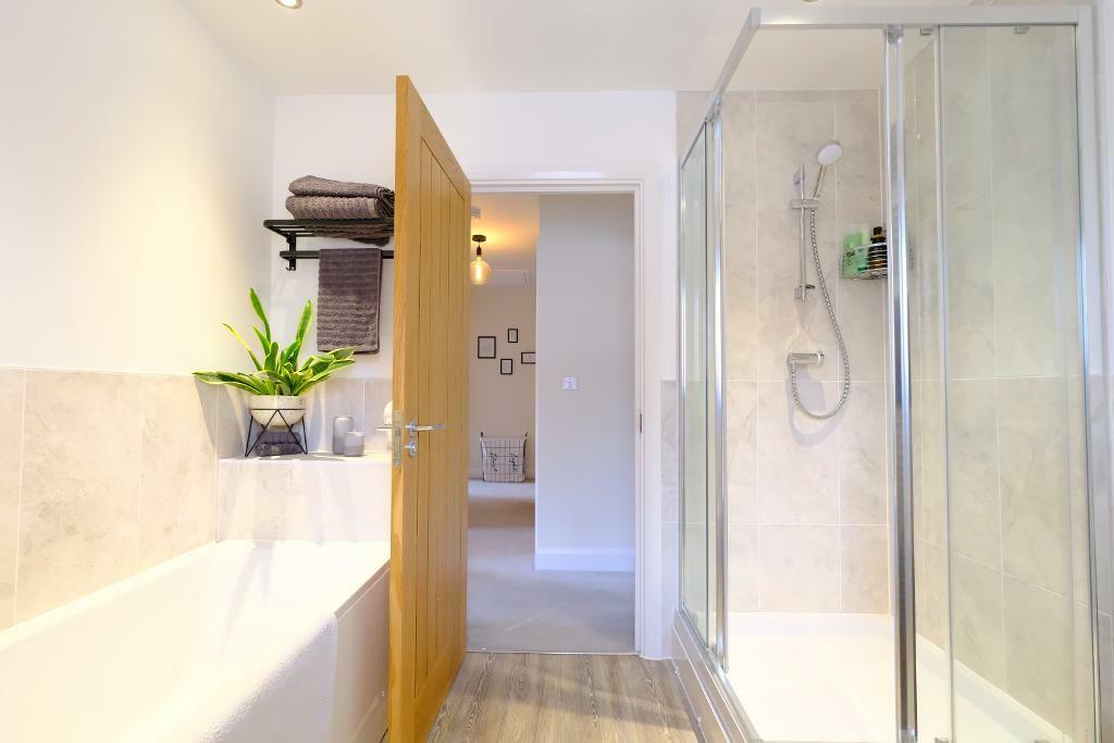 Family bathroom with bath and shower
