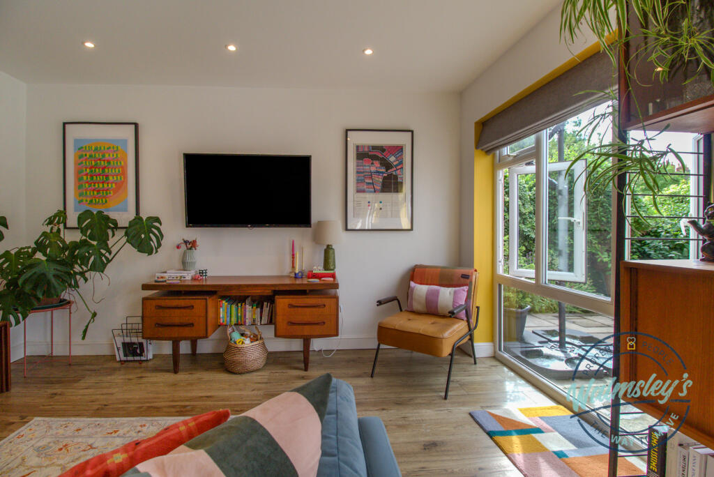 Bright &amp; characterful sitting room to rear