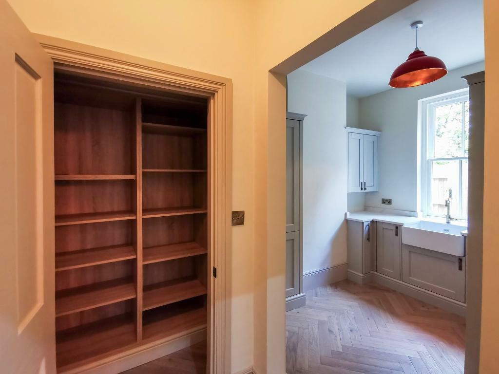 Utility and walk-in pantry cupboard