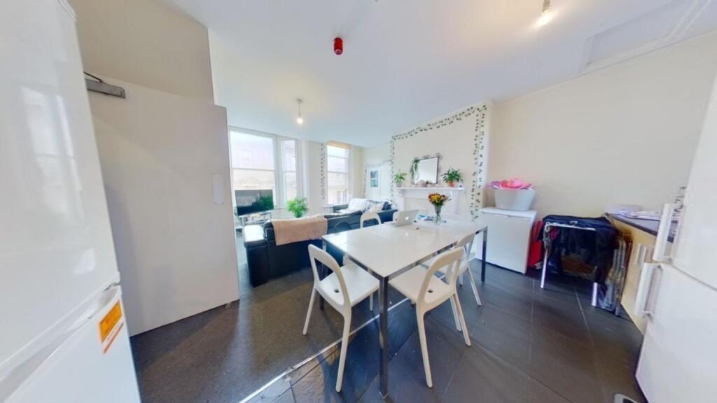 Bright and modern kitchen area with a clean, op...