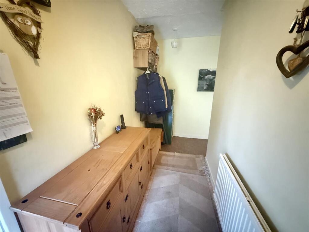 Front recessed entrance door to: