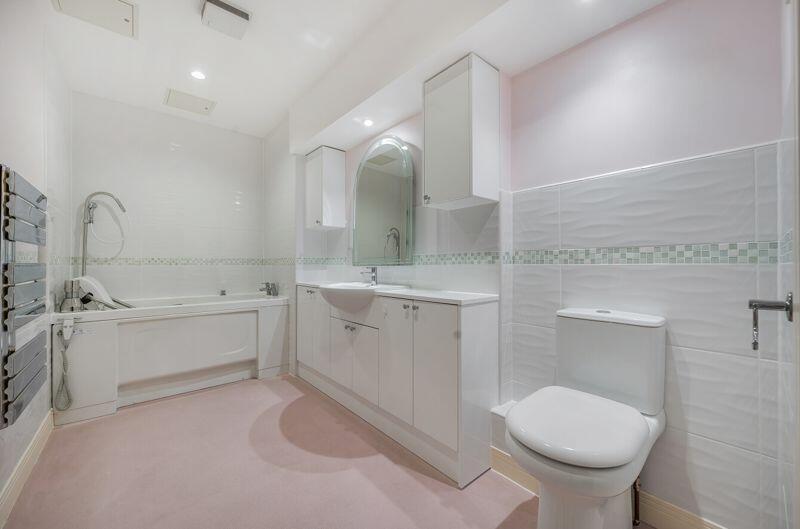 Bathroom with adapted bath