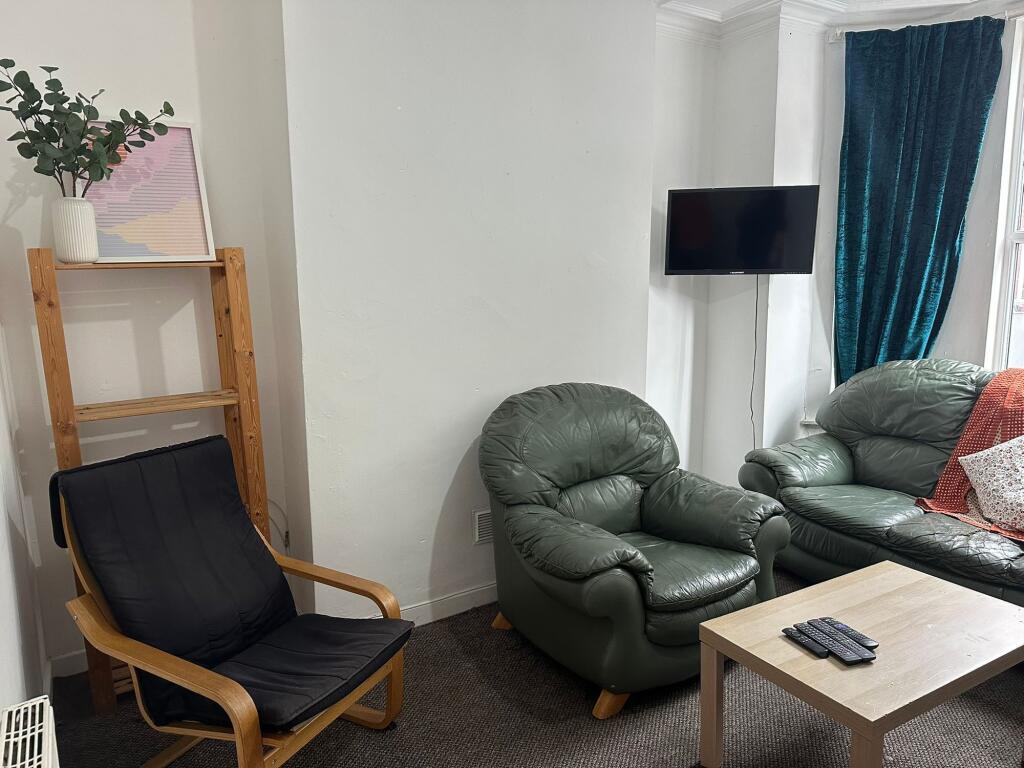 A cozy living room featuring comfortable leathe...